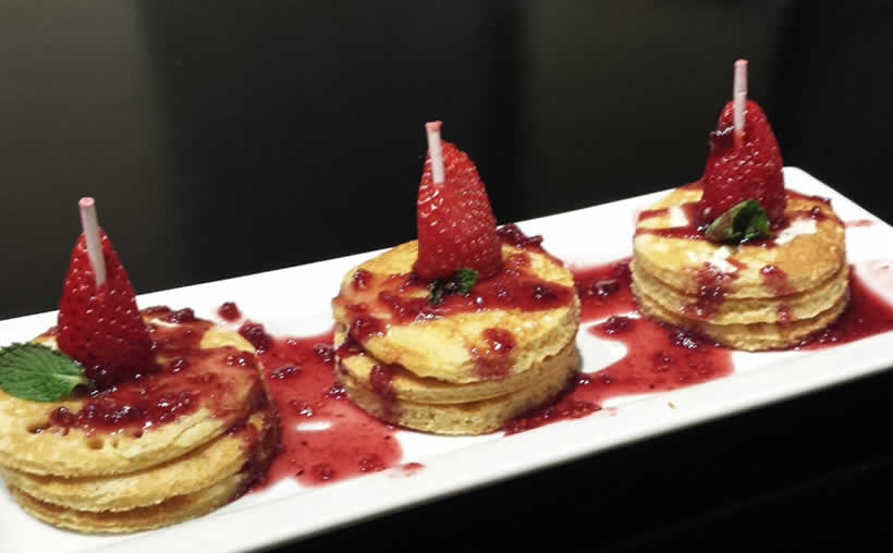 Mini Gluten-Free Pancakes Topped With Strawberry Syrup